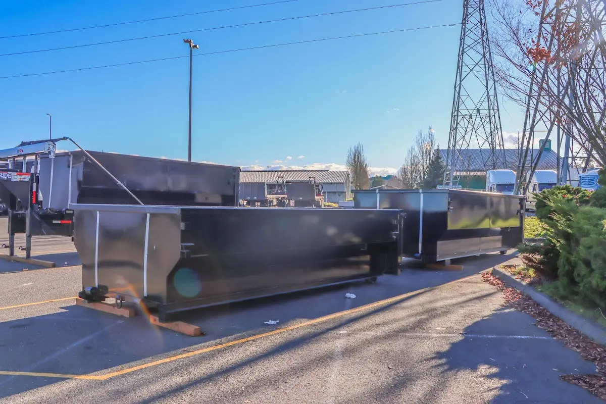 Roll-off dumpster ready for waste disposal at job site for Concrete Dumpster Rental in Temple Hills